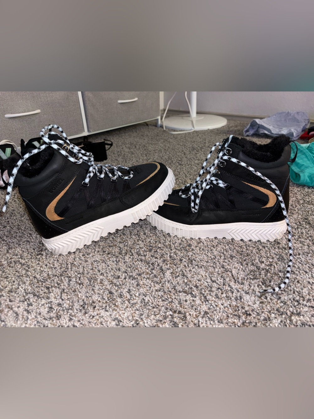 Black High-Top Sneakers with White Soles and Patterned Laces